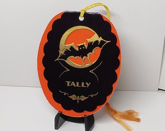 Vintage circa 1920's-30's unused oval shaped die cut gold gilded halloween themed bridge tally card black bat flying