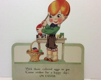 Adorable 1920's unused die cut colorful NOS Hallmark Easter cut out greeting card little boy in knickers painting his basket of Easter eggs