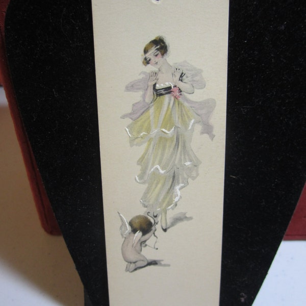 Gorgeous 1910's-20's unused bridge tally card hand colored edwardian dressed maiden and cupid on his knees shooting an arrow at her