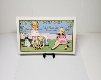 Colorful embossed gold gilded 1930's unused Easter postcard adorable graphics of children toddlers holding and petting baby chicks in grass
