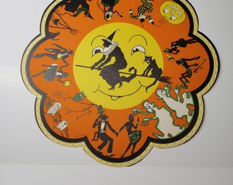 Unused mint 1920’s die cut Whitney halloween paper doily table decoration black cats, witch flying on broom, ghosts,graveyard,cauldron,owl
