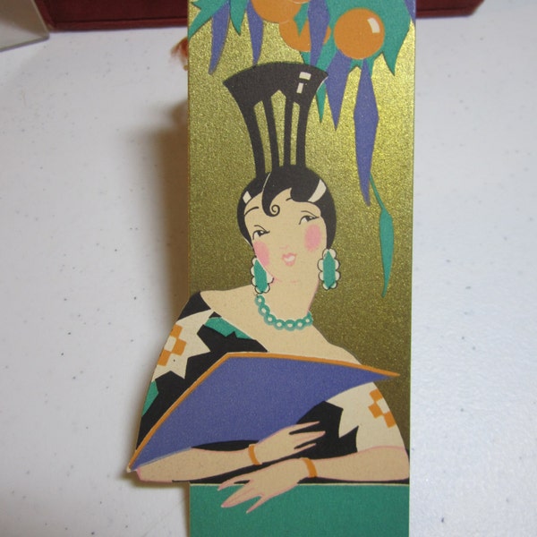 Gorgeous 1920's unused die cut and gold gilded Gibson bridge tally card pretty spanish lady holding purple fan wearing elaborate hair comb