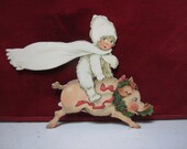 Unused 1920 39 s die cut Germany christmas place card snow baby riding a pig with wreath around its neck and mistletoe in mouth