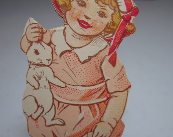 Vintage 1920's unused colorful  Dennison's die cut easter cut out of sweet toddler girl holding a rabbit and an eggshell