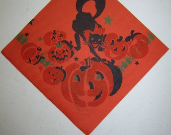 Unused 1940&#39;s-50&#39;s halloween paper napkin colorful graphics of black cat wearing a bow and walking across several jack o&#39;lanterns