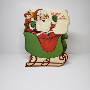 Unused vintage 1940&#39;s-50&#39;s die cut Paramount novelty Christmas card mini Santa Claus die cut card inside large card of his green sleigh toys