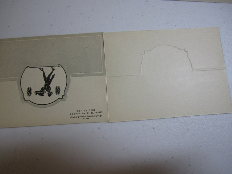 1920/'s  unused die cut silhouette place cards designed by E.B eating and more in original envelope Bird colonial people courting