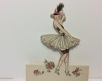 Darling unused 1920's die cut hand colored Art Deco Place card dancer short dress garters showing and hat with feather signed by artist MHS