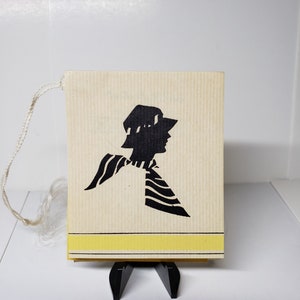 Vintage 1930&#39;s unused art deco Styled By Henderson bridge tally card black silhouette profile of deco lady wearing cloche hat matching scarf