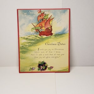 Vintage unused colorful Art Deco 1930&#39;s nautical themed Christmas card old fashioned sailing ship sailing with seagulls holly berry