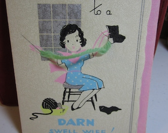 1930's art deco unused birthday card to a darn swell wife graphics of lady holding real yarn darning socks in polka dotted dress