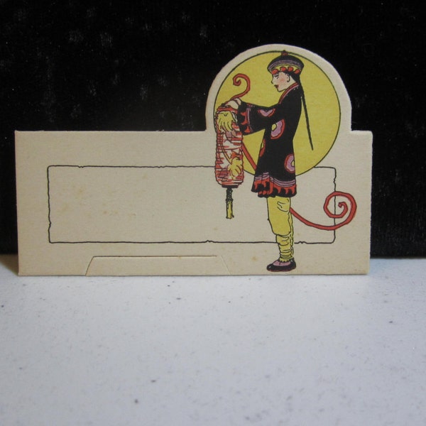 Art deco die cut place card 1930's unused with graphics of asian man holding a decorative paper lantern