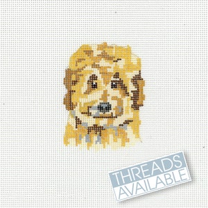 May include: A cross-stitch pattern of a golden doodle dog with brown eyes and a black nose. The dog is looking directly at the viewer. The pattern is on a white background.