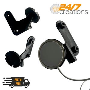 May include: Several black plastic components are shown against a white backdrop. These include brackets and a circular piece. The logo for "24/7 creations" is in the upper right. A graphic of a truck with "Fast & Free" is in the lower left.