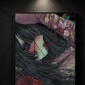 May include: A framed artwork featuring a stylized illustration of a person with long black hair and a pale complexion. The artwork has a dark, moody aesthetic with splashes of red and pink, and decorative floral and heart motifs.