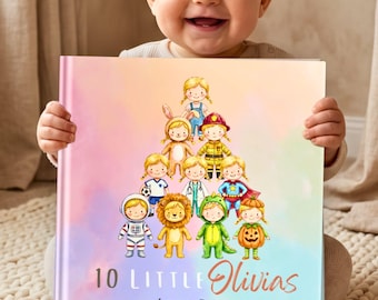 Peut inclure: Un livre à couverture rigide carré avec un fond aquarelle pastel représentant dix enfants illustrés en divers costumes disposés en pyramide. Le texte sur la couverture indique 10 Little Olivias Learn to Count en lettres noires et orange.