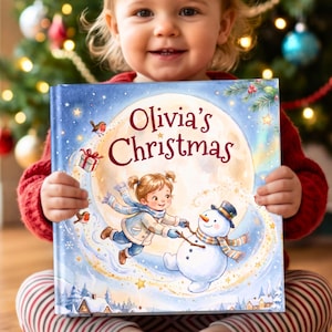 May include: A square hardback book titled Olivia's Christmas featuring a colourful illustration of a child building a snowman under a large moon. The cover includes images of robins, a gift box, and snowy houses, all set against a blue background.