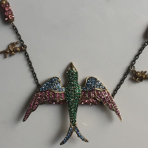 Repurposed jewelry necklace with bird, multicolored rhinestones