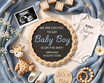 May include: A baby announcement set featuring a round scalloped sign with the text WE ARE EXITED TO SAY Baby Boy IS ON THE WAY! ARRIVING AUGUST 2026, a white onesie with Baby Johnson, a giraffe plush, wooden blocks spelling BABY, ultrasound, and shoes.
