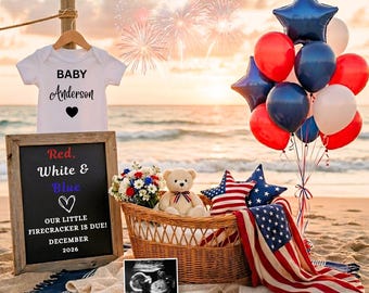 May include: A patriotic baby announcement scene on a beach. A white onesie with "BABY Anderson" printed on it hangs above a chalkboard that reads "Red, White & Blue" and "OUR LITTLE FIRECRACKER IS DUE! DECEMBER 2026." A wicker basket holds a teddy bear, flowers, and a sonogram.
