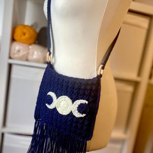 May include: A set of three ceramic mugs with a speckled, matte finish. The mugs are in shades of cream, light gray, and dark gray. Each mug has a simple, minimalist design, perfect for coffee or tea.