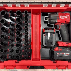 May include: A set of three ceramic vases in varying heights. The vases are white with a matte finish and feature a textured, ridged design. The tallest vase is approximately 10 inches high.