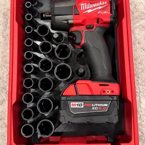May include: A set of three ceramic mugs with a speckled, matte finish in cream, light grey, and dark grey. Each mug has a minimalist design and a rounded handle. Ideal for tea or coffee.