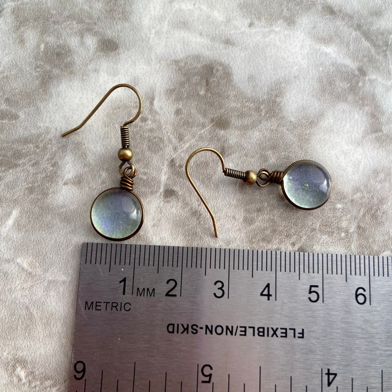 Size reference photo of the spring rain drop earrings using the metric side of the ruler.