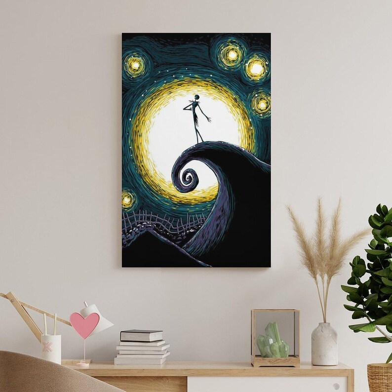 May include: A canvas print featuring a stylized depiction of Jack Skellington from The Nightmare Before Christmas. The artwork showcases a swirling hill, a bright yellow moon, and a starry night sky. The color palette includes shades of blue, yellow, and black.