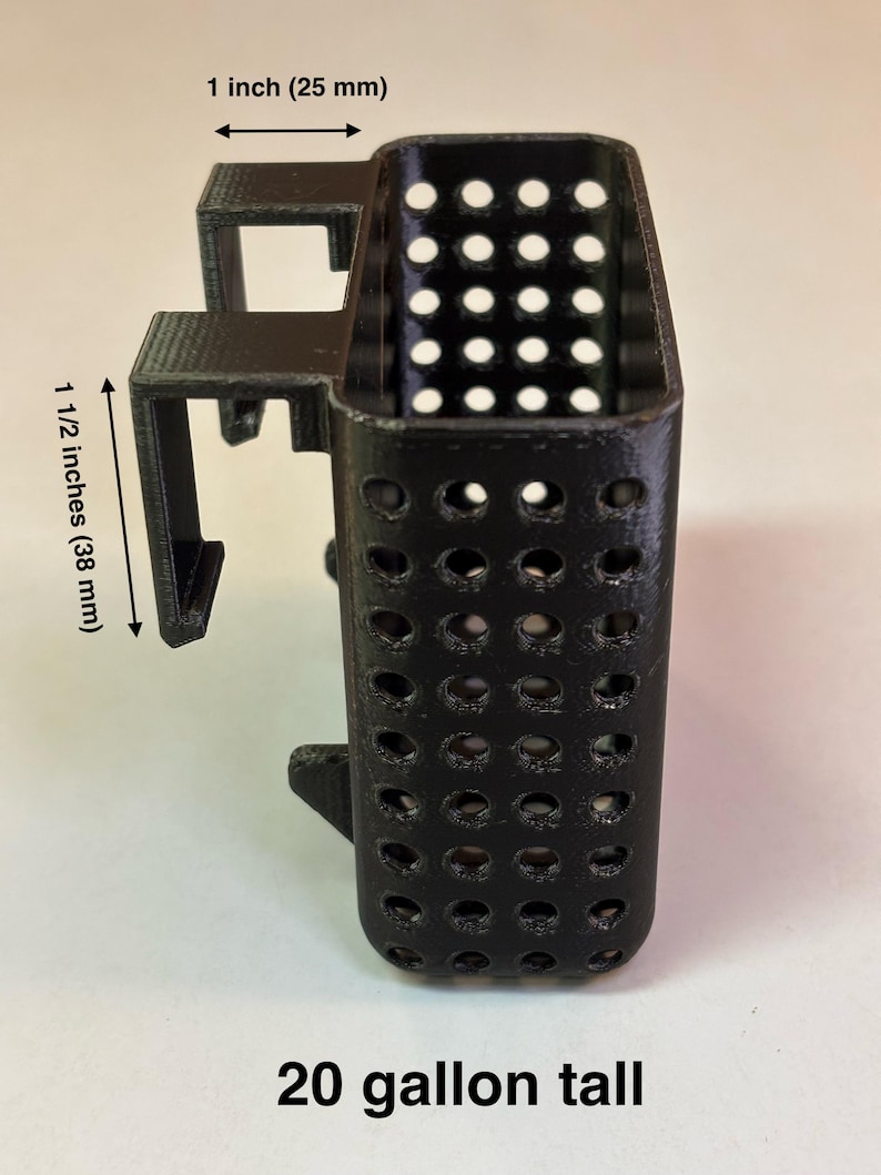 May include: Black, rectangular container with a perforated design. The container is 1 inch (25 mm) wide and 1 1/2 inches (38 mm) tall. The text "20 gallon tall" is printed at the bottom.