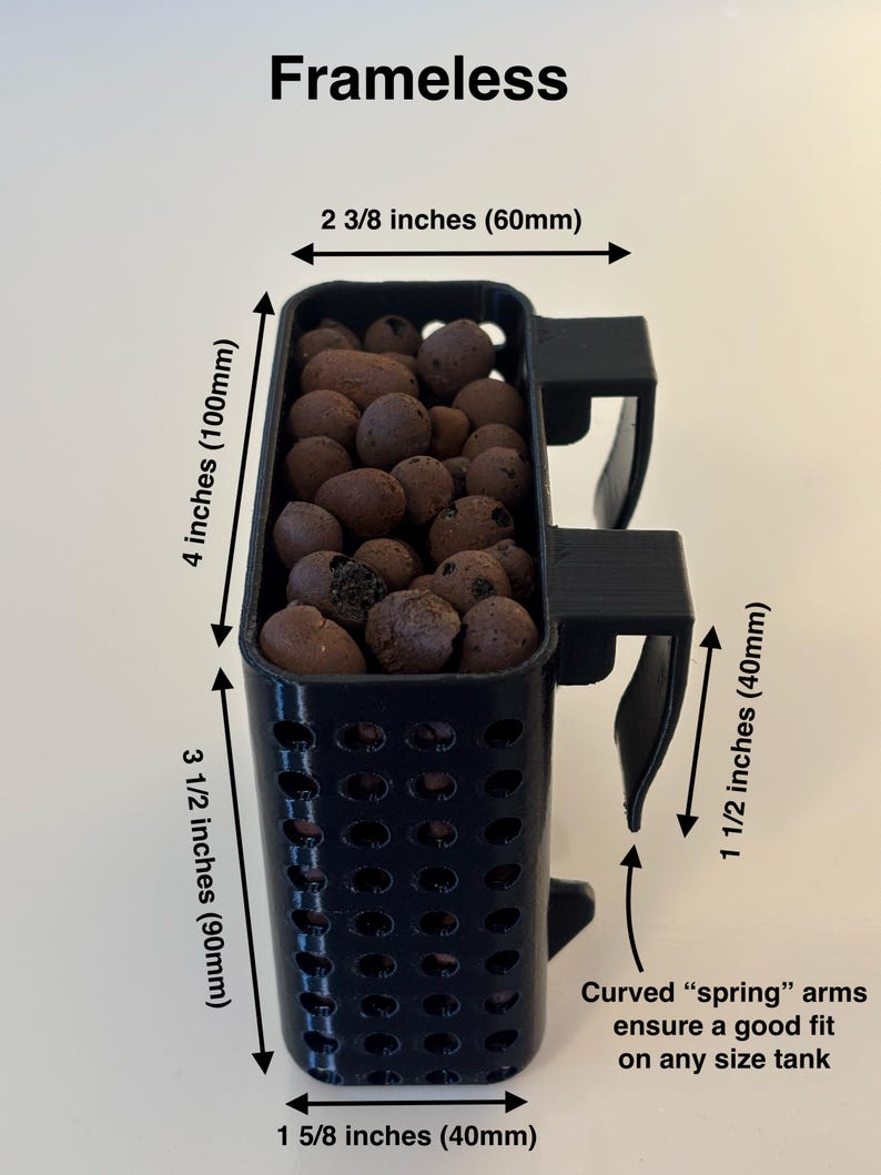 May include: Black rectangular plant pot with curved spring arms. The pot is 4 inches (100mm) tall, 3 1/2 inches (90mm) wide, and 1 5/8 inches (40mm) deep. It is filled with brown pebbles. The text "Frameless" is at the top.
