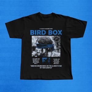 May include: A set of three ceramic mugs with a speckled, matte finish. The mugs are in shades of cream, light gray, and dark gray. Each mug has a simple, minimalist design and a rounded handle. The mugs are likely for coffee or tea.