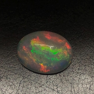 Exquisita gema de ópalo ovalado etíope AAA, ópalo de fuego raro para diseñadores de joyería fina, 2,26 quilates.