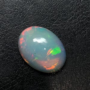 Auténtica gema de ópalo ovalado etíope AAA, ópalo de fuego de primera calidad para la fabricación de joyería fina, 2,26 quilates.