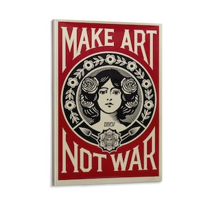 May include: A red and cream-colored art print with the words "MAKE ART NOT WAR" in bold letters. The central image is a woman's face surrounded by a floral wreath. The word "OBEY" is below the face.