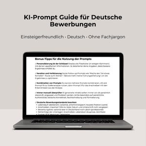 May include: A laptop screen showing a German guide titled "KI-Prompt Guide für Deutsche Bewerbungen". The screen displays advice on using prompts, including personalization and iteration. The laptop is on a neutral surface.