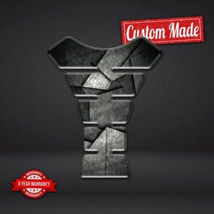 May include: A motorcycle tank protector with a geometric design in shades of gray and black. The words "Custom Made" are displayed on a red banner. A red badge with the text "5 Year Warranty" is also visible.