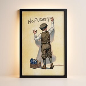 May include: Framed print featuring a vintage illustration of a young boy writing "No Fucks Given" on a wall. The boy is dressed in a tweed vest, cap, and knickerbockers. A basket with items sits at his feet.