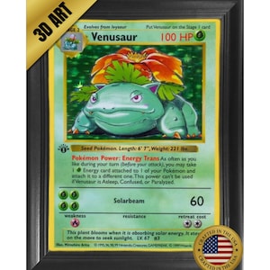 May include: Framed 3D art of a Venusaur Pokémon card. The card features a green and orange creature with the text "Venusaur" and "100 HP." The frame is black with a gold accent. The card is 6' 7" long and weighs 221 lbs.