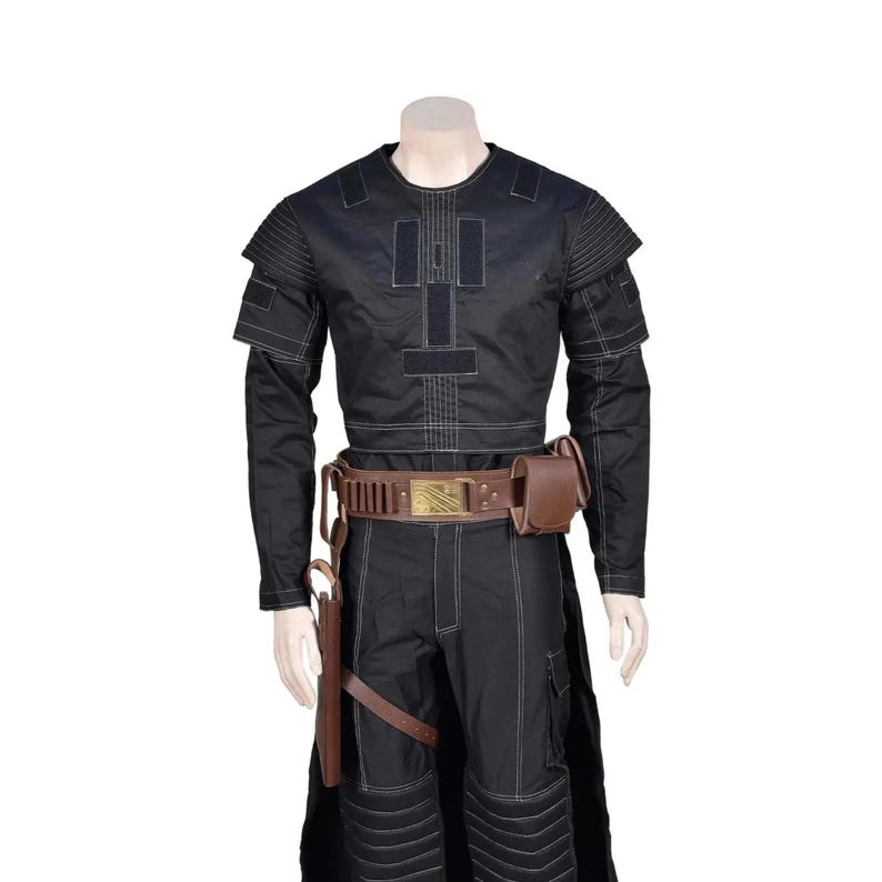 May include: A black tactical long-sleeve shirt and matching trousers featuring white contrast stitching, shoulder padding, and a brown leather utility belt with a gold-toned buckle, ammunition loops, a side pouch, and a holster attachment.