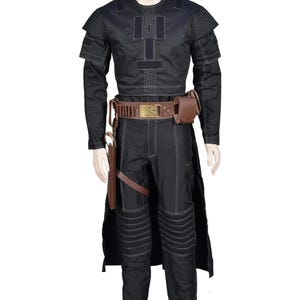 May include: A black long-sleeved shirt and matching pants set featuring white contrast stitching, shoulder padding, and ribbed knee panels. A brown utility belt with a gold buckle, attached pouches, and a holster is worn over the outfit.