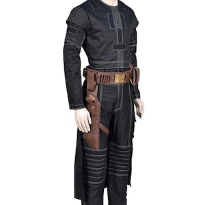 May include: A black long-sleeved shirt and matching trousers featuring white topstitching, ribbed shoulder and knee panels, and a brown leather utility belt with a holster and gold-toned buckle worn over the waist of the black trousers.