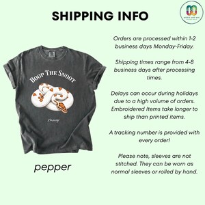 May include: Dark gray t-shirt with a graphic of a white and brown snake and the text "BOOP THE SNOOT". The word "pepper" is at the bottom of the shirt.
