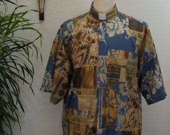 Camisa CAMP Clerical, estampado tropical Blue Eden. Totalmente de algodón. Elige tu talla y confección a medida. Disponible con TAB o banda completa. Estilo sin meter.