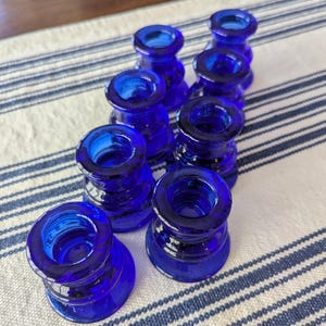 May include: A set of three ceramic mugs with a speckled, matte finish. The mugs are in shades of cream, light gray, and dark gray. Each mug has a simple, modern design and a rounded handle. Perfect for coffee or tea.