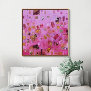 Pink and orange expressionist painting making a bold statement in a white room.