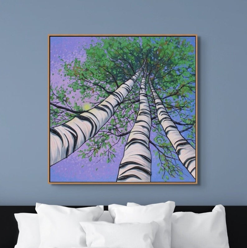 Large birch tree painting in mauve and blue in bedroom over bed.