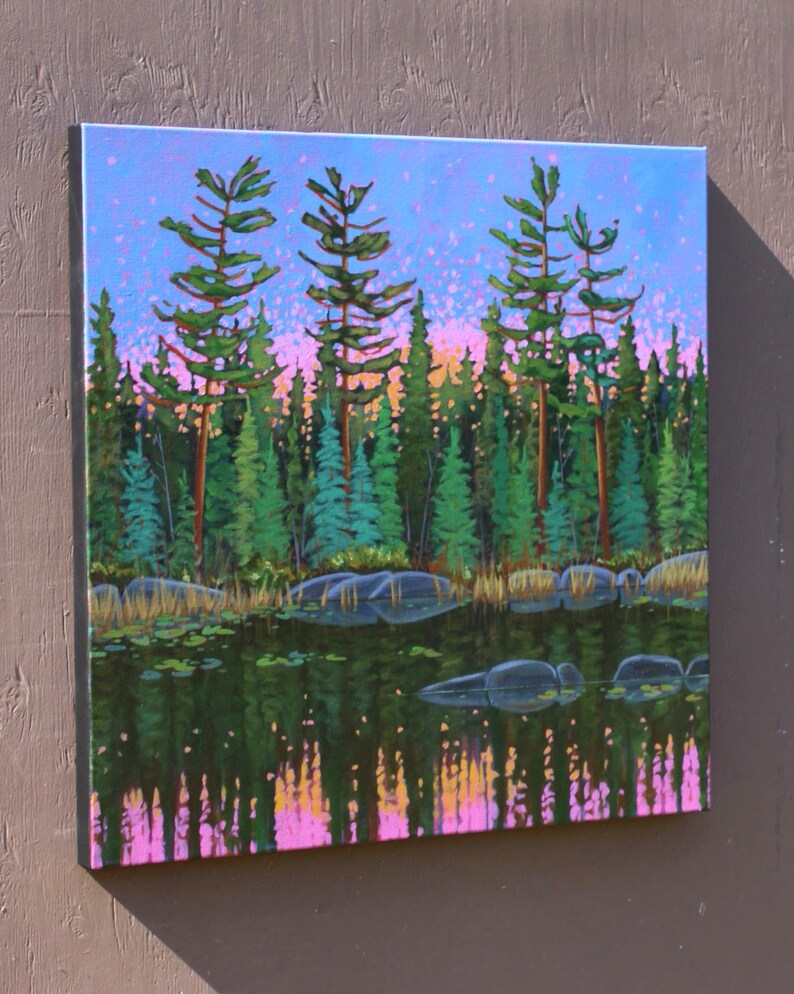 Tall tree painting of lake in pink, purple, and green.