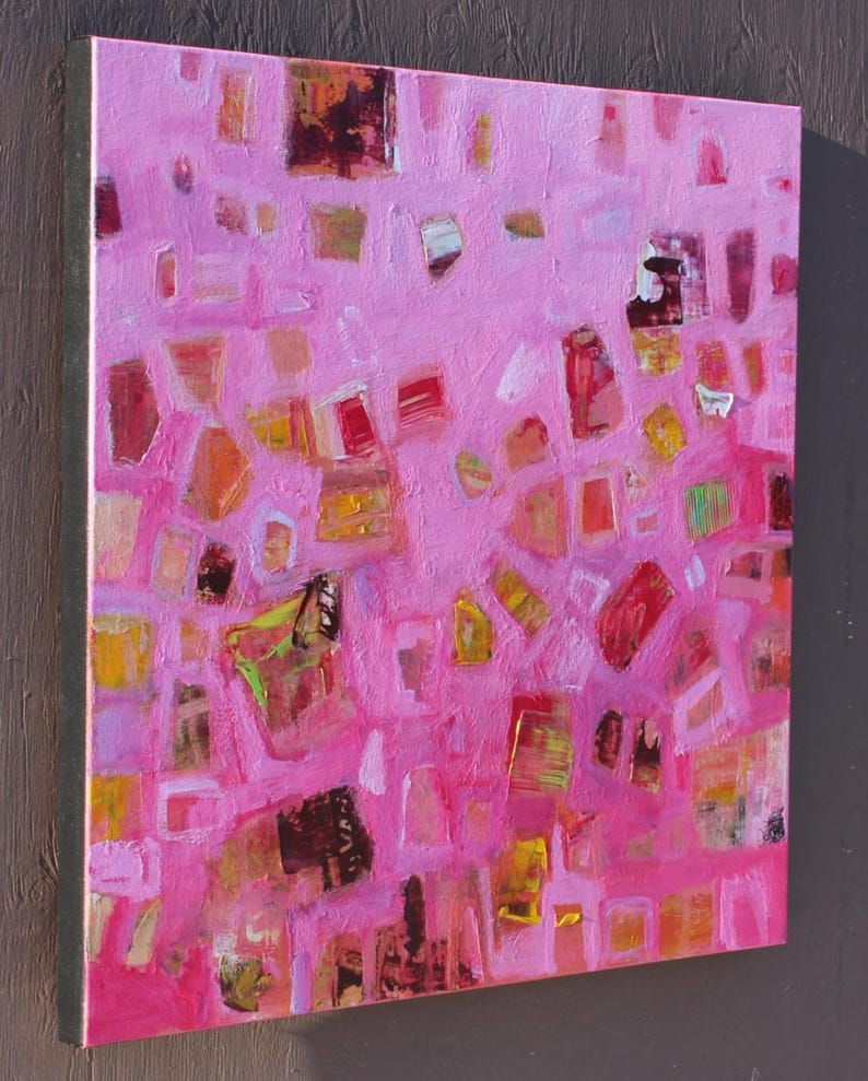 Side view of lively pink and orange abstract with shapes in cool and warm tones.