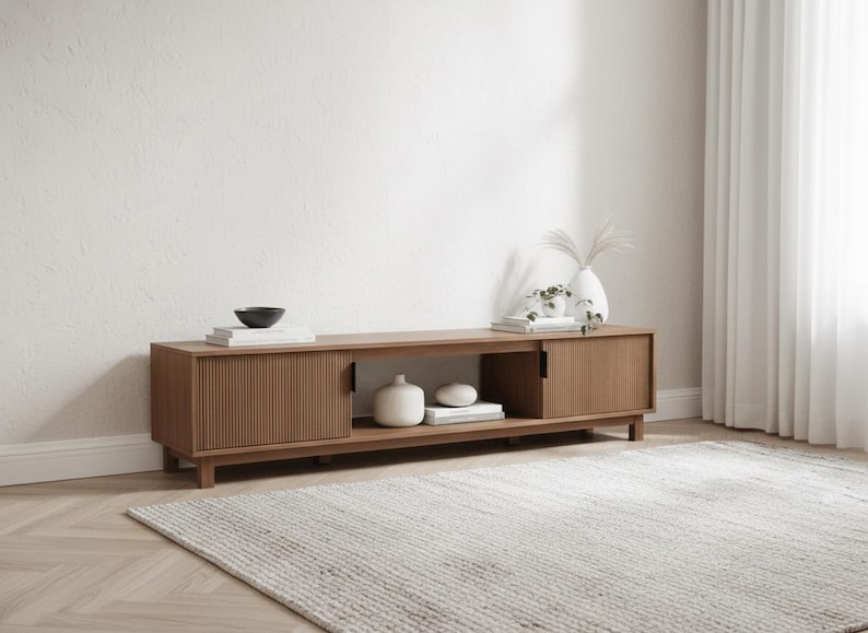 70 inch mocha fluted TV stand styled in modern living room with large flat screen TV